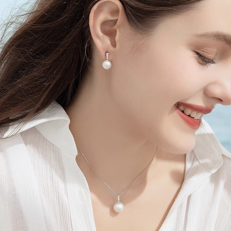 Australian white pearl earrings, 18K gold diamond earrings, elegant and sophisticated women's style.